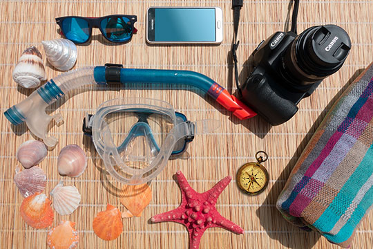 vacation-travel-sunglasses-smartphone-camera-diving-mask-snorkel-compass
