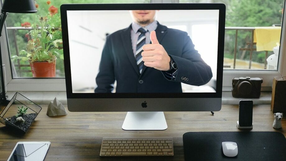 A computer screen showing a man giving a thumbs up.