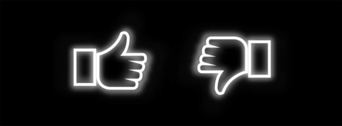 Two thumbs up and thumbs down icons on a black background.
