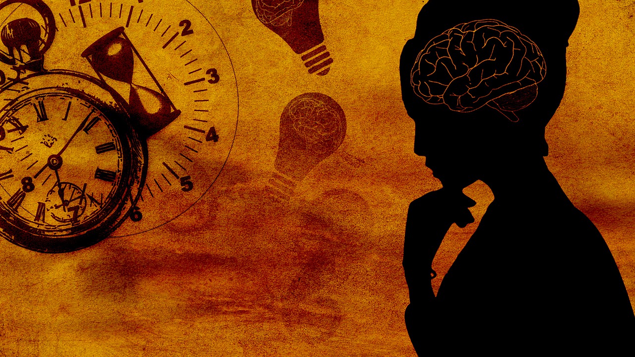 A silhouette of a woman with a clock.