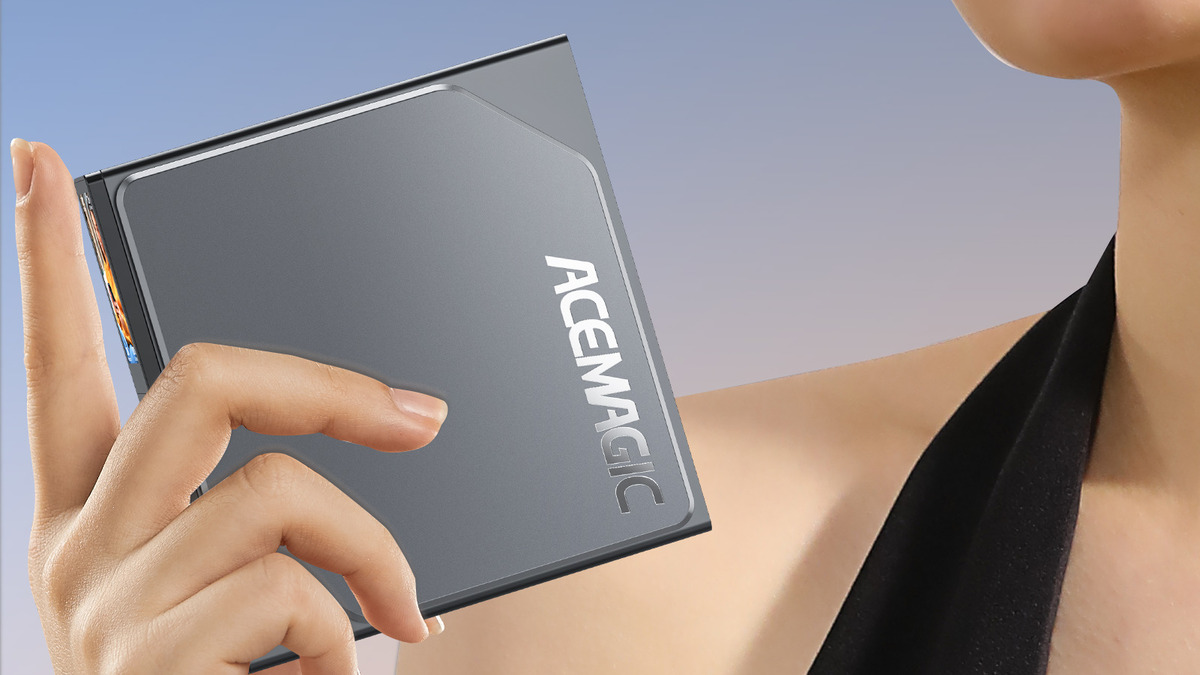 A woman is holding up an ACEMAGIC S1 Mini PC.